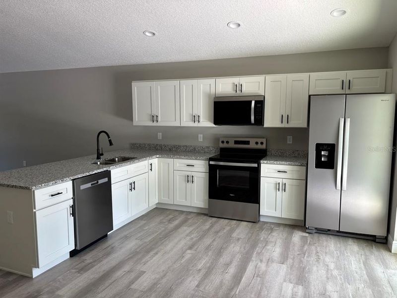 Furnished interior view inside a new home in , Dunnellon (Image 6).