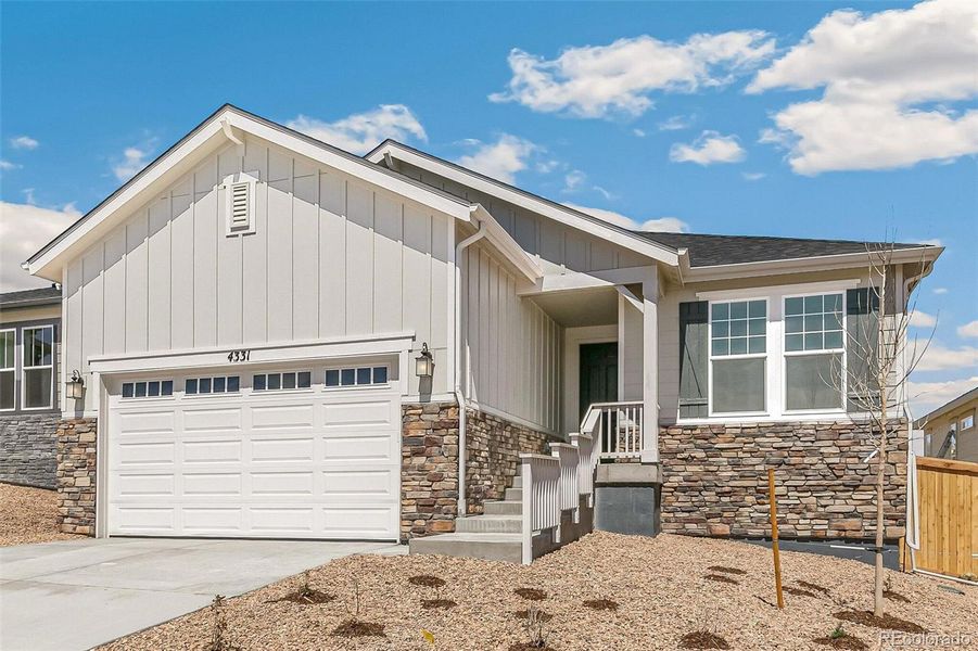 Front exterior of a new home in Terrain Oak Valley, Castle Rock, CO, highlighting curb appeal (Image 2). Front exterior of a new home in Terrain Oak Valley, Castle Rock, CO, highlighting curb appeal (Image 2).