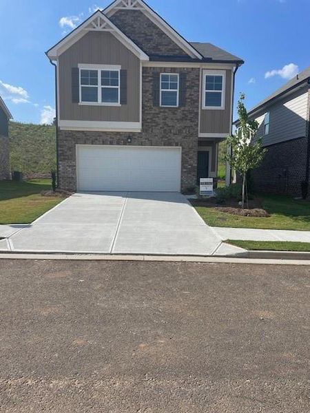Front exterior of a new home in Alcovy Village, Lawrenceville, GA, highlighting curb appeal (Image 2).