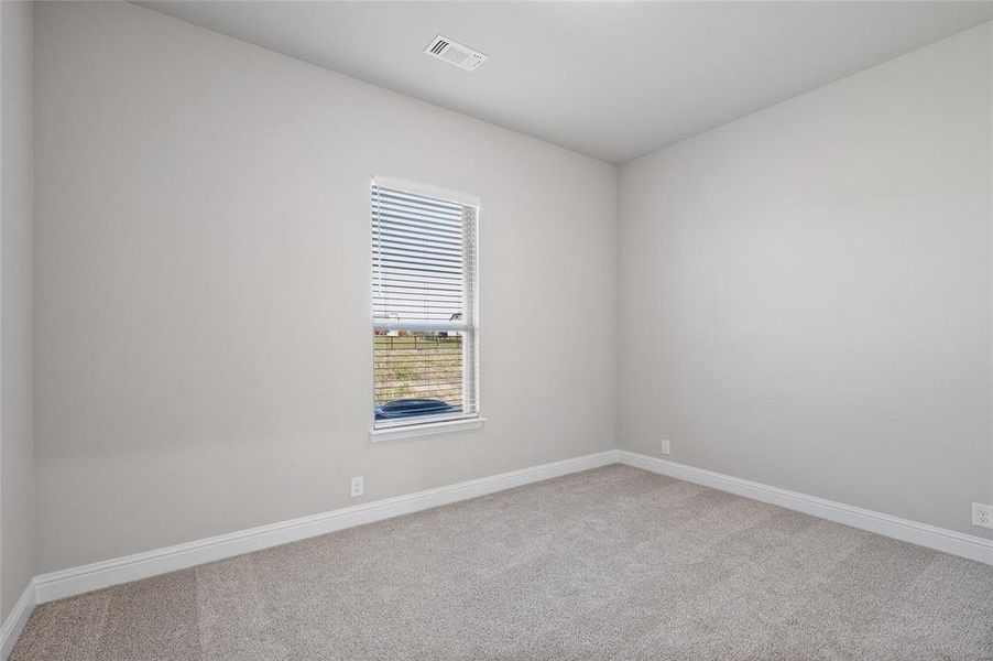 Spare room with light carpet