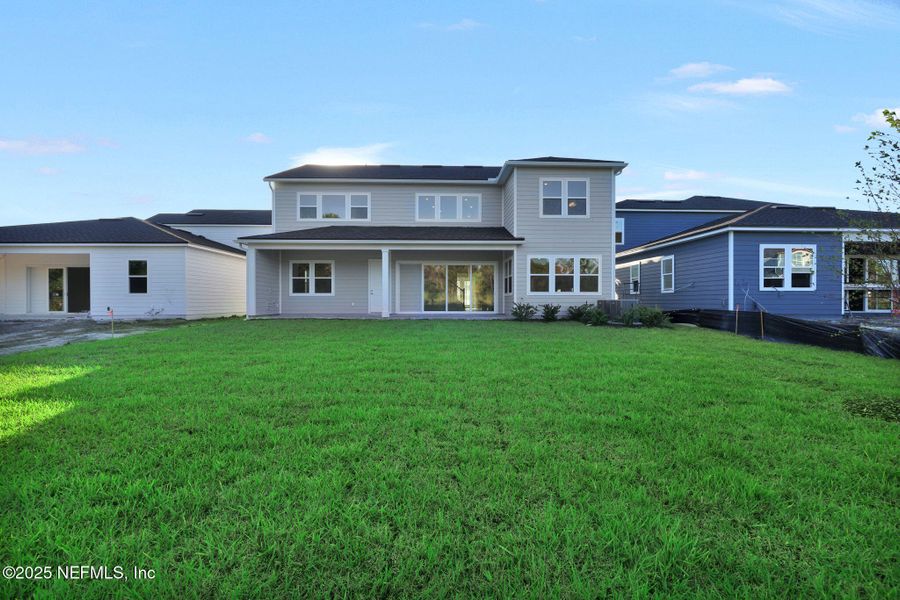 Exterior details and patio area of a home in The Landings at Saint Johns, St. Johns (Image 17).