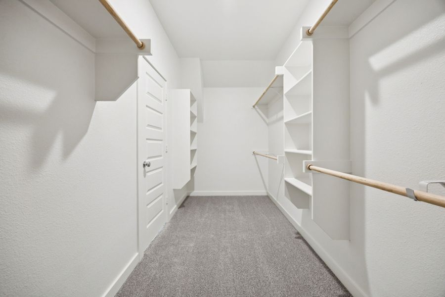 Primary Closet in the Heisman home plan by Trophy Signature Homes – REPRESENTATIVE PHOTO Primary Closet in the Heisman home plan by Trophy Signature Homes – REPRESENTATIVE PHOTO