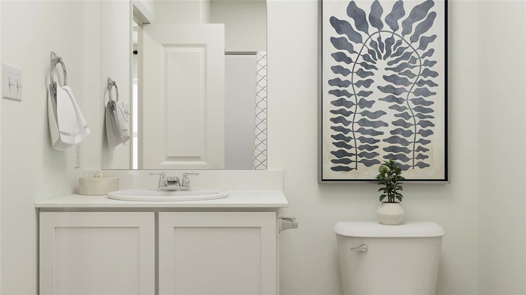 Bathroom with vanity, toilet, and a shower with shower curtain