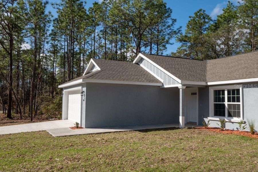 Front exterior of a new home in , Citrus Springs, FL, highlighting curb appeal (Image 22).