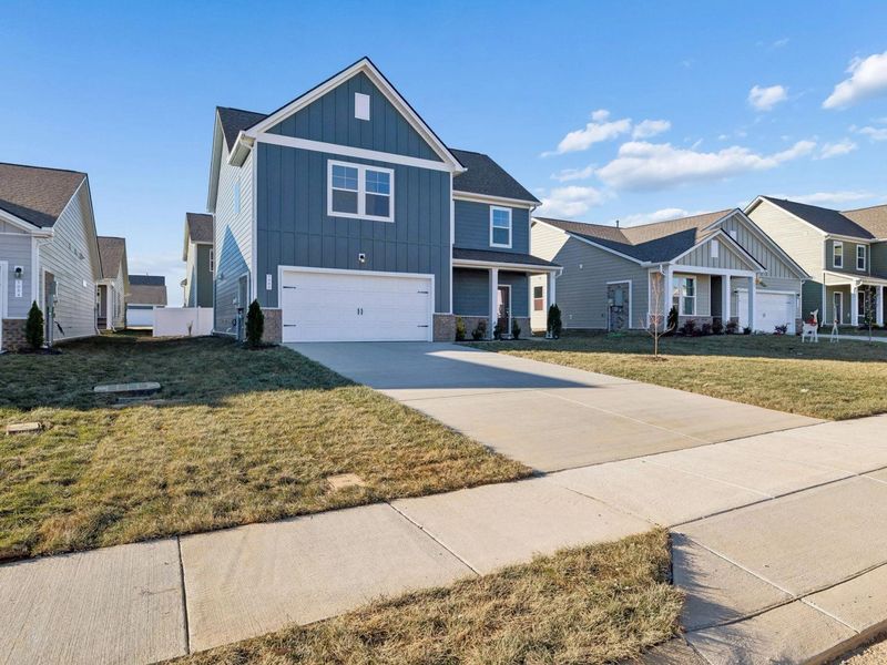 Front exterior of a new home in Sage Farms, White House, TN, highlighting curb appeal (Image 22).