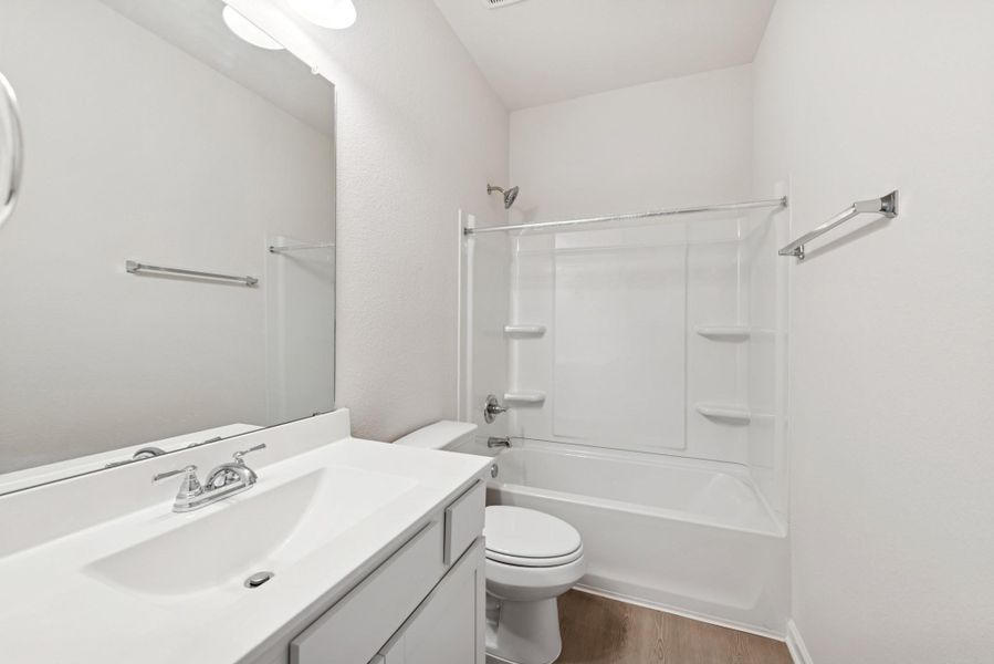 The Cardinal II- Hall Bath 2. Photos of home shown are for illustration only; actual features, colors, and upgrades may vary. The Cardinal II- Hall Bath 2. Photos of home shown are for illustration only; actual features, colors, and upgrades may vary.