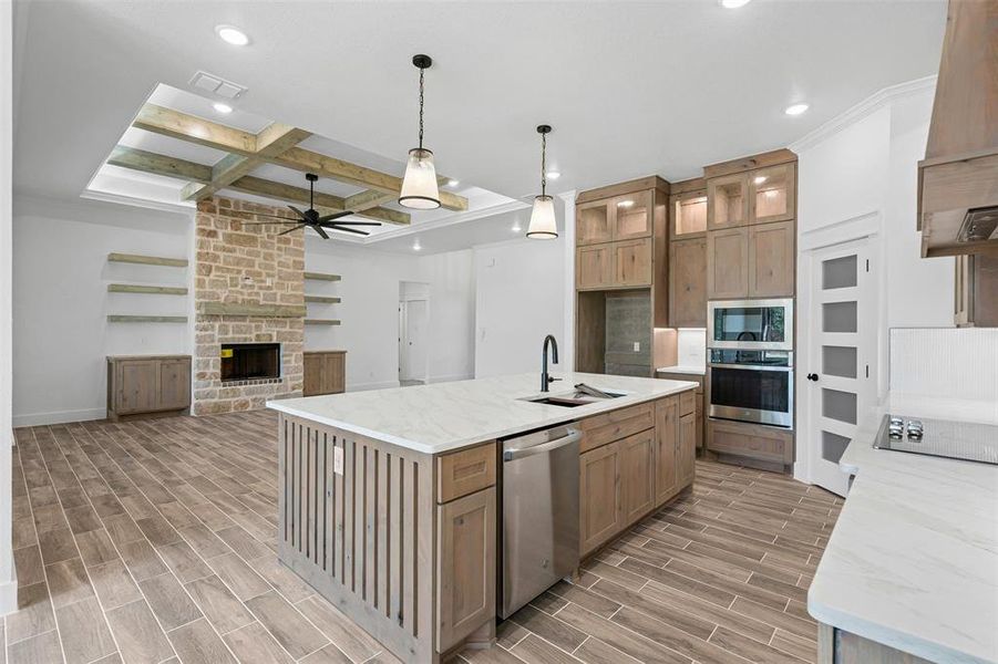 Kitchen featuring coffered ceiling, wood finish floors, a ceiling fan, beamed ceiling, and recessed lighting Kitchen featuring coffered ceiling, wood finish floors, a ceiling fan, beamed ceiling, and recessed lighting