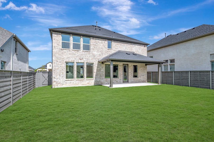Exterior details and patio area of a home in Union Park, Little Elm (Image 2). Exterior details and patio area of a home in Union Park, Little Elm (Image 2).