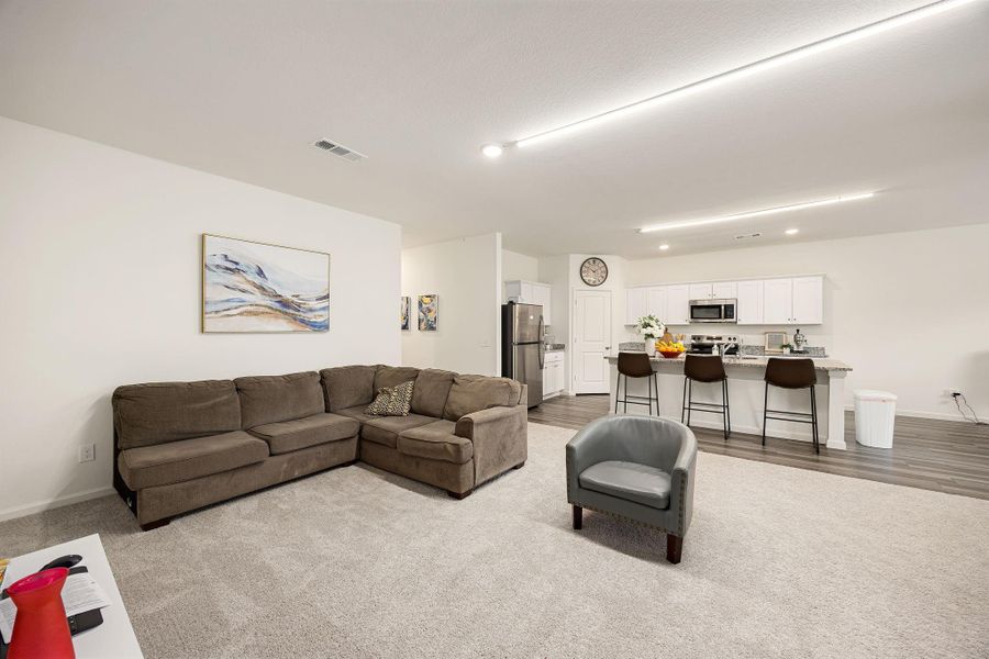 Bright and spacious living room with an open-concept design.