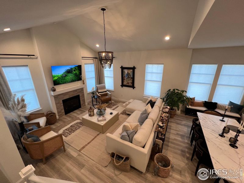 Large living room with vaulted ceilings and Arhaus Chandelier Large living room with vaulted ceilings and Arhaus Chandelier