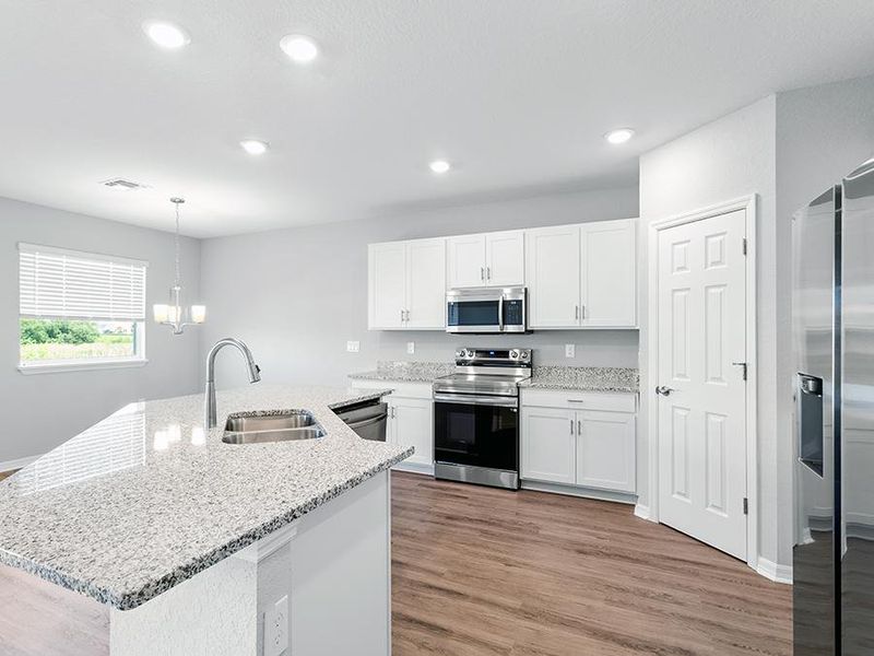 Your beautiful kitchen includes granite countertops, 36-inch cabinets, and Samsung appliances.