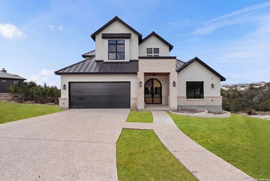 Front exterior of a new home in , Boerne, TX, highlighting curb appeal (Image 24).