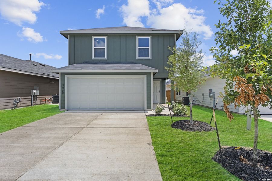 Front exterior of a new home in Blue Ridge Ranch, San Antonio, TX, highlighting curb appeal (Image 1). Front exterior of a new home in Blue Ridge Ranch, San Antonio, TX, highlighting curb appeal (Image 1).