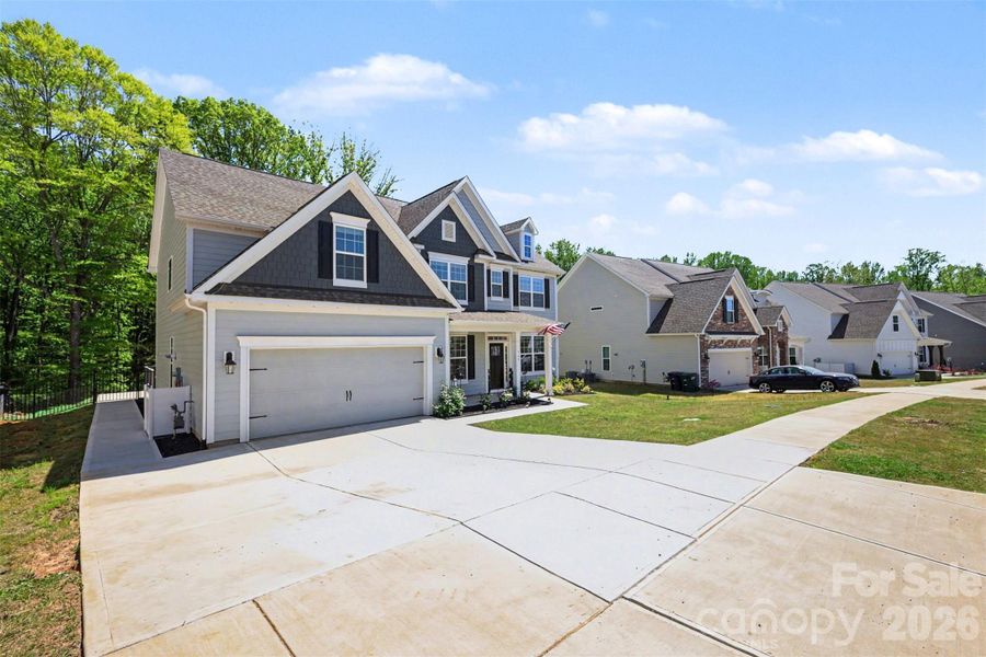Front exterior of a new home in Falls Cove, Troutman, NC, highlighting curb appeal (Image 25).