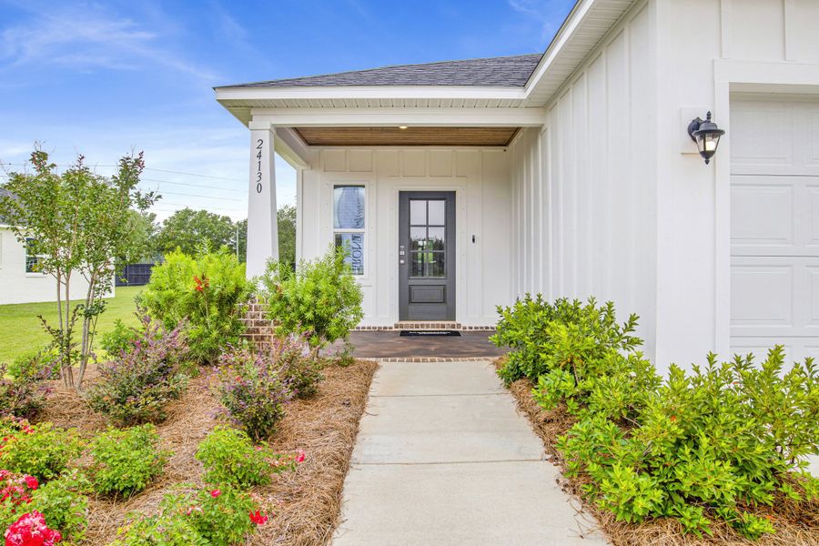 Exterior details and patio area of a home in Coastal Communities, Edgewater (Image 31).
