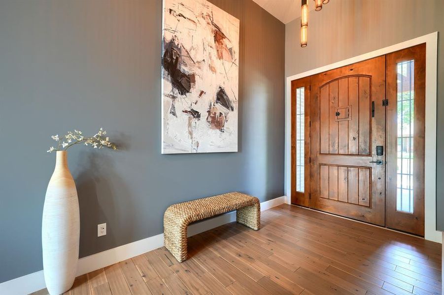 Entrance foyer with baseboards and wood-type flooring Entrance foyer with baseboards and wood-type flooring
