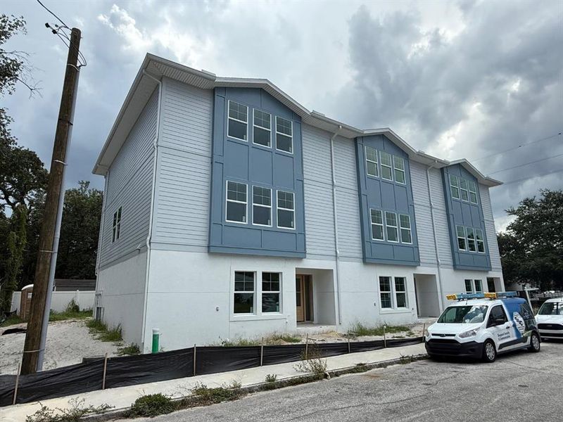 Front exterior of a new home in , Tampa, FL, highlighting curb appeal (Image 1).