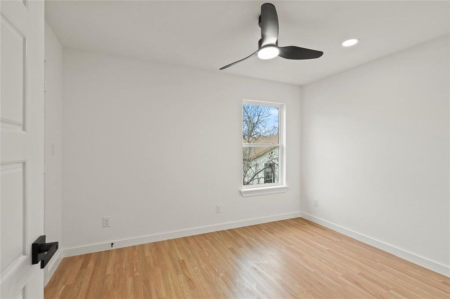 Spare room featuring light hardwood / wood-style floors and ceiling fan