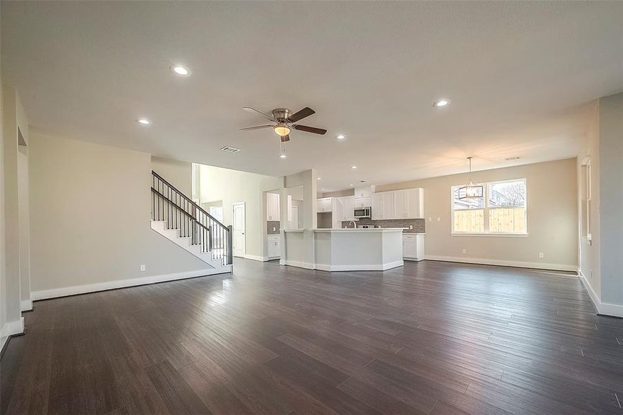 Open concept living room to kitchen view