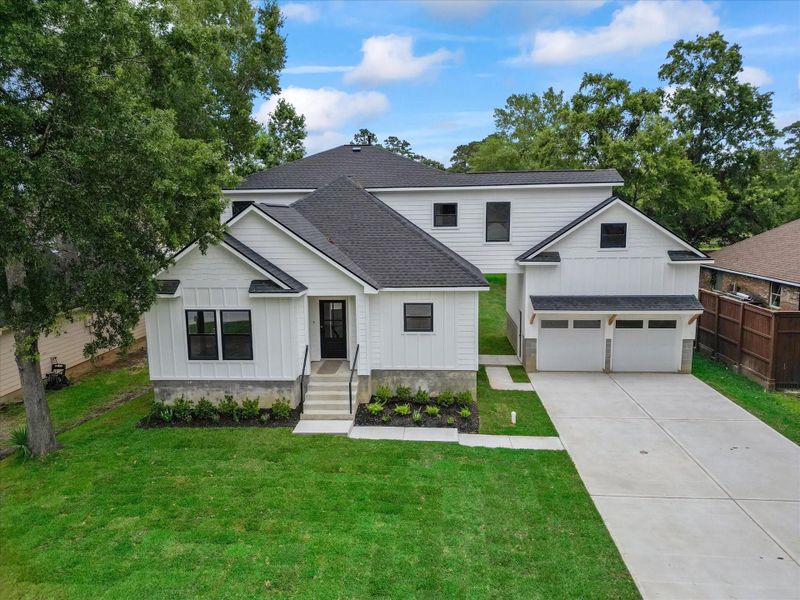 Front exterior of a new home in , Conroe, TX, highlighting curb appeal (Image 1). Front exterior of a new home in , Conroe, TX, highlighting curb appeal (Image 1).
