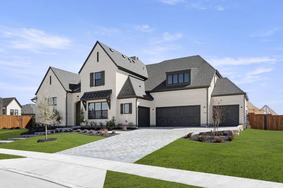 Front exterior of a new home in Mustang Lakes, Celina, TX, highlighting curb appeal (Image 2). Front exterior of a new home in Mustang Lakes, Celina, TX, highlighting curb appeal (Image 2).