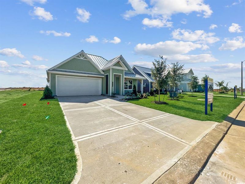 Front exterior of a new home in Grand Cay Harbour, Texas City, TX, highlighting curb appeal (Image 22). Front exterior of a new home in Grand Cay Harbour, Texas City, TX, highlighting curb appeal (Image 22).