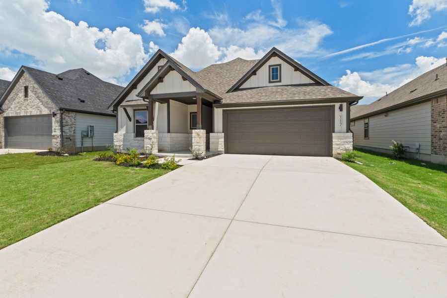 Front exterior of a new home in Prairie Winds, Hutto, TX, highlighting curb appeal (Image 20). Front exterior of a new home in Prairie Winds, Hutto, TX, highlighting curb appeal (Image 20).