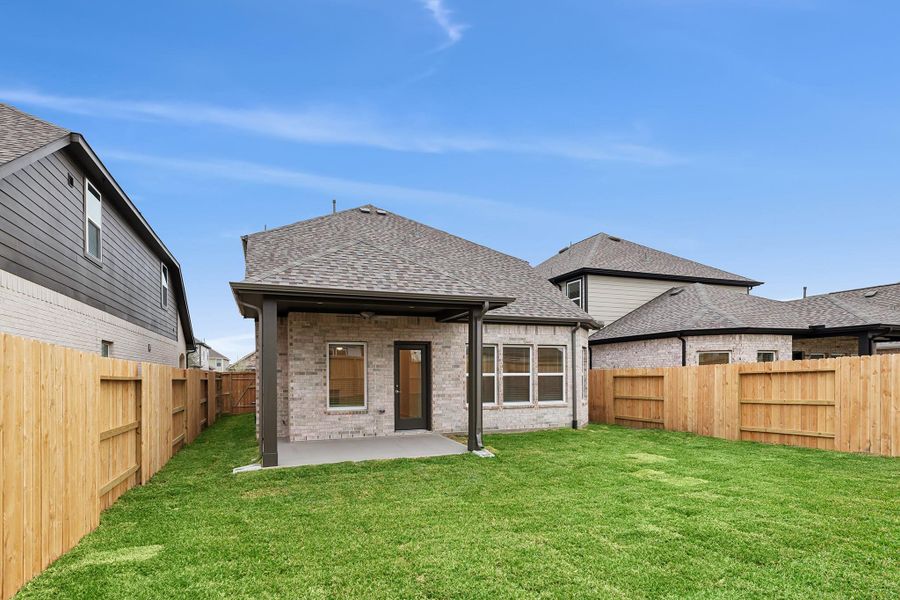 Exterior details and patio area of a home in Marvida, Cypress (Image 4).