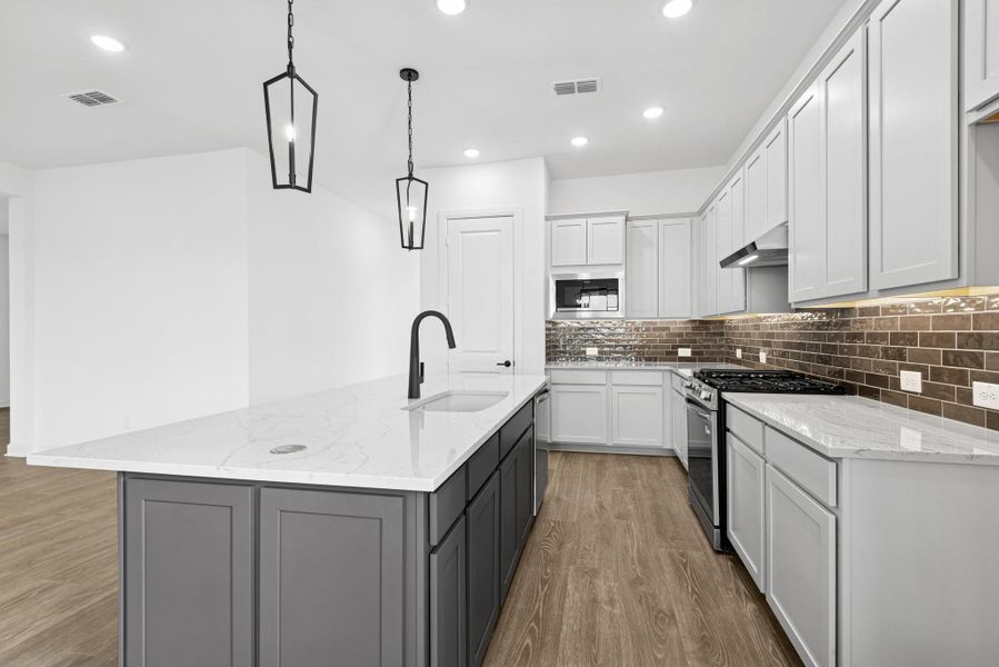 Furnished interior view inside a new home in Riceland - Enclave Row Collection, Mont Belvieu (Image 4).