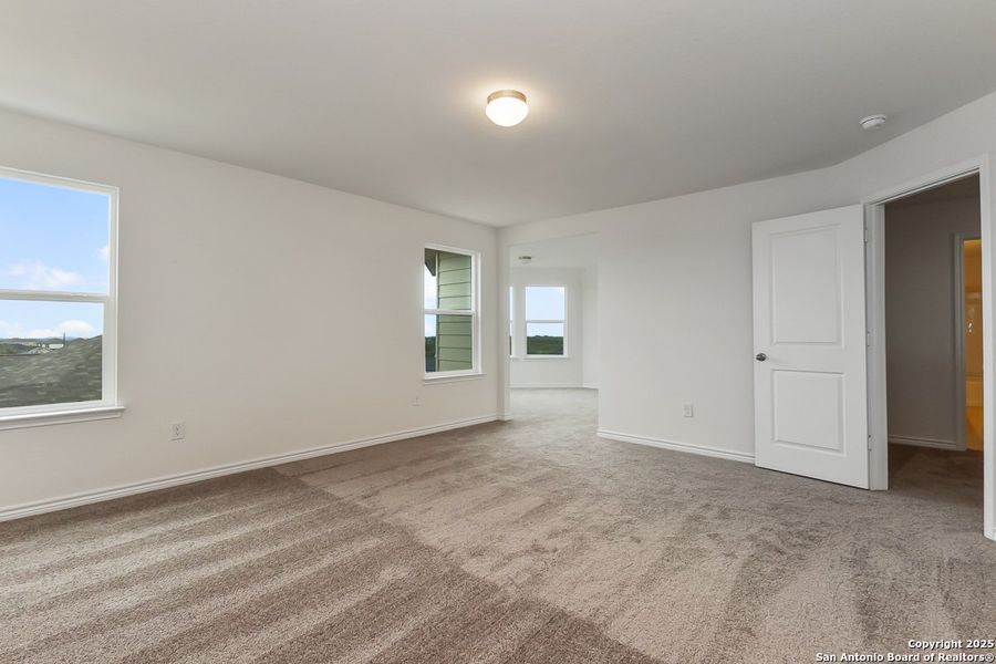 Spacious, unfurnished interior of a new home in Hidden Bluffs at TRP, San Antonio (Image 9).