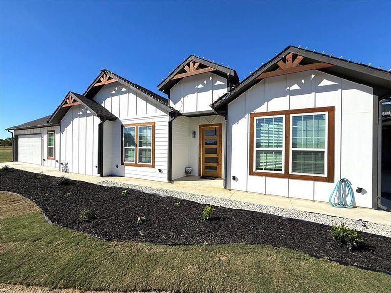 Front exterior of a new home in , Terrell, TX, highlighting curb appeal (Image 1).