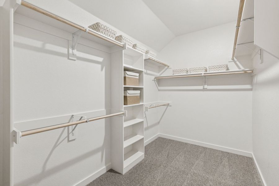 Primary Closet in the Oscar home plan by Trophy Signature Homes – REPRESENTATIVE PHOTO