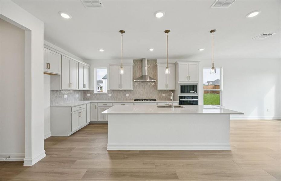 Spacious kitchen with eat-in bartop island Spacious kitchen with eat-in bartop island