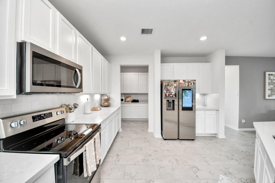 Furnished interior view inside a new home in , Cypress (Image 9).