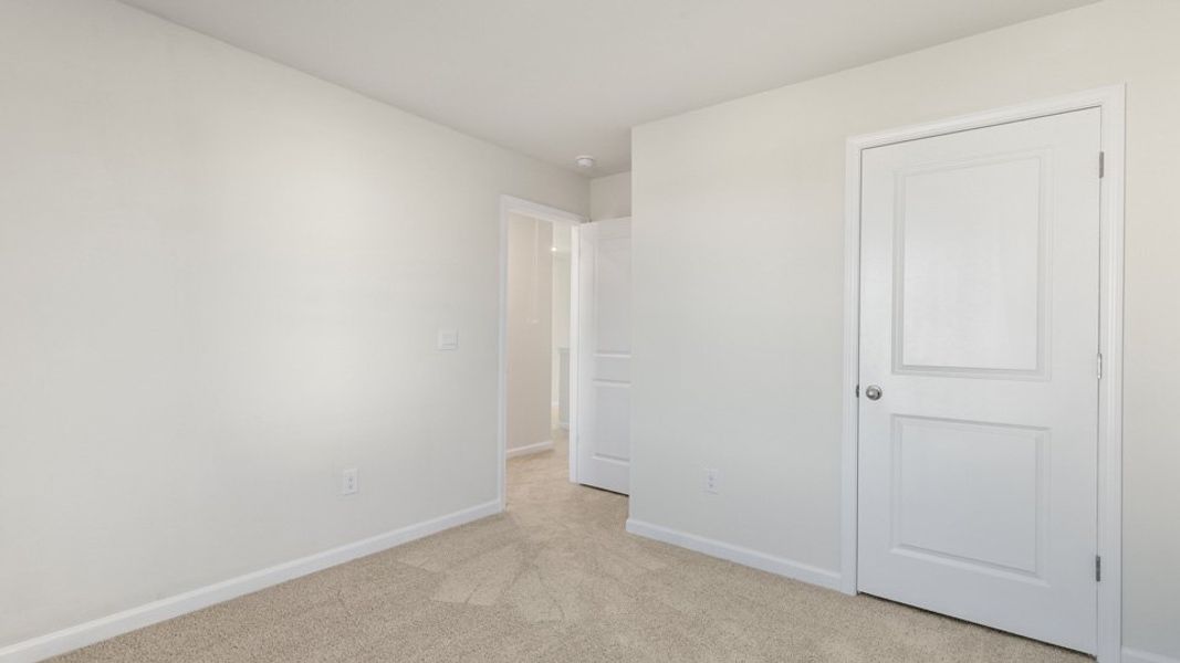 Spacious, unfurnished interior of a new home in The Townes at Honeycutt Oaks, Angier (Image 18).