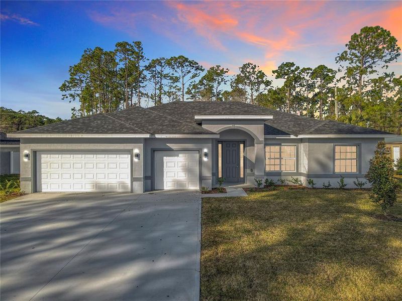 Front exterior of a new home in , Palm Coast, FL, highlighting curb appeal (Image 27). Front exterior of a new home in , Palm Coast, FL, highlighting curb appeal (Image 27).