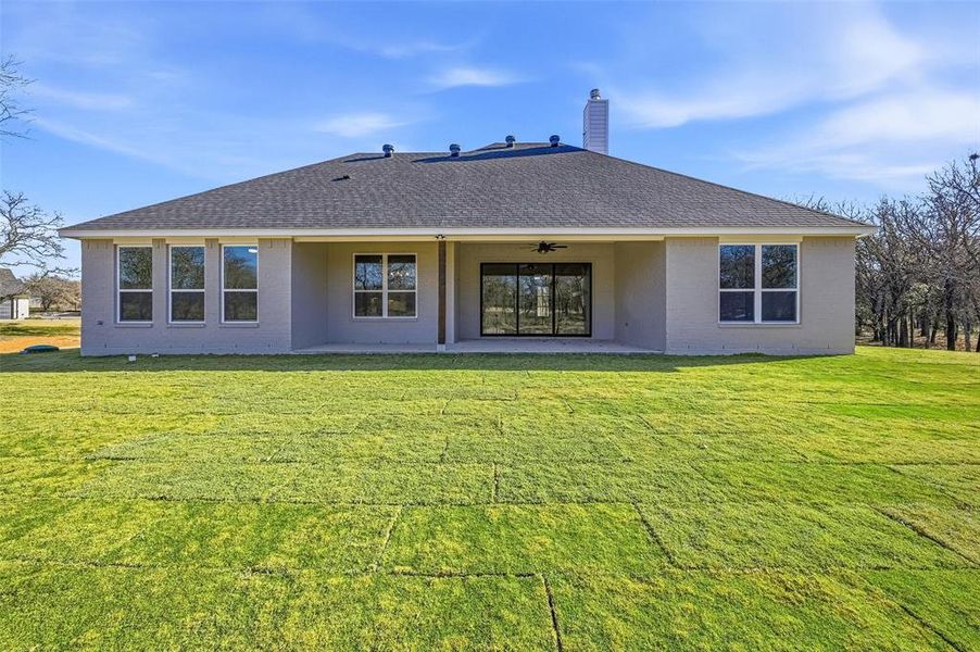 Exterior details and patio area of a home in Escondido Ranches, Poolville (Image 25).
