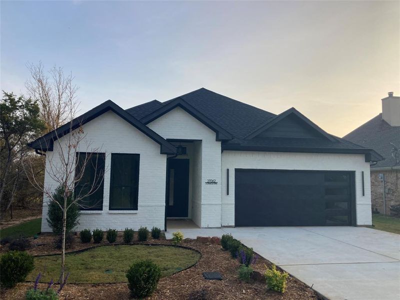 Front exterior of a new home in , Whitney, TX, highlighting curb appeal (Image 2). Front exterior of a new home in , Whitney, TX, highlighting curb appeal (Image 2).