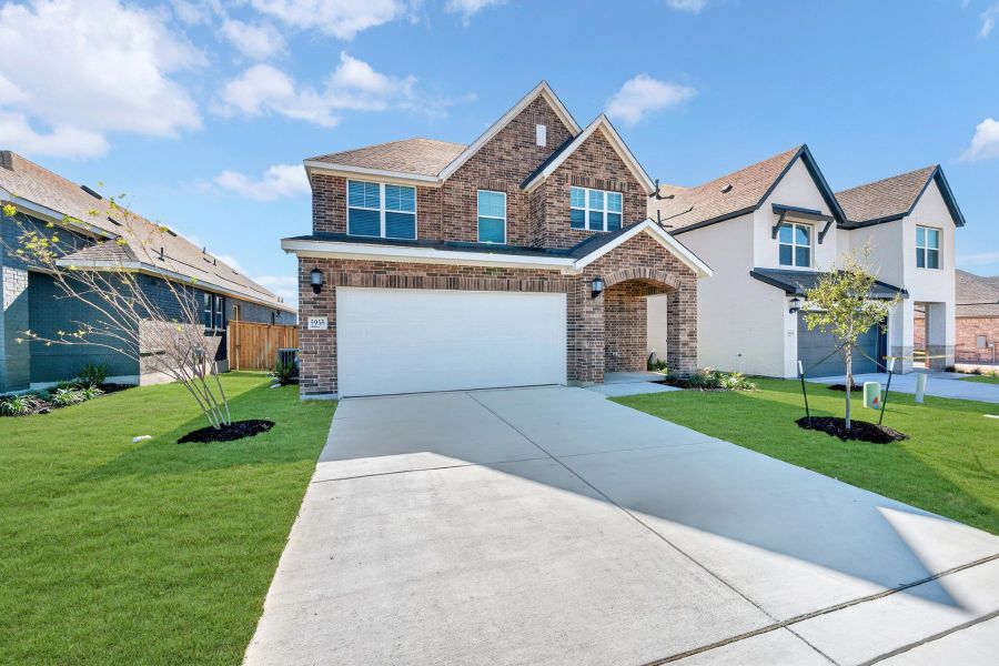 Front exterior of a new home in Mayfair - Select Garden Series, New Braunfels, TX, highlighting curb appeal (Image 1).
