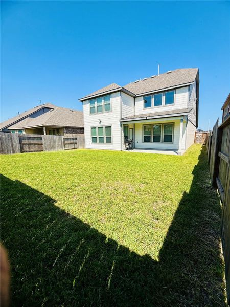 Front exterior of a new home in Mavera, Conroe, TX, highlighting curb appeal (Image 27).