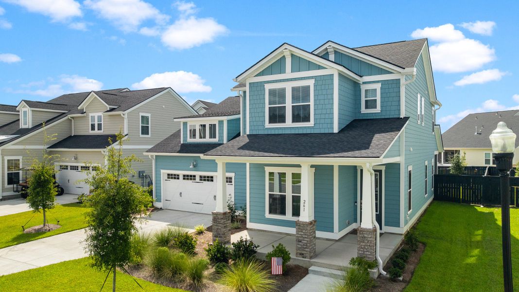 Front exterior of a new home in Carnes Crossroads, Summerville, SC, highlighting curb appeal (Image 2). Front exterior of a new home in Carnes Crossroads, Summerville, SC, highlighting curb appeal (Image 2).