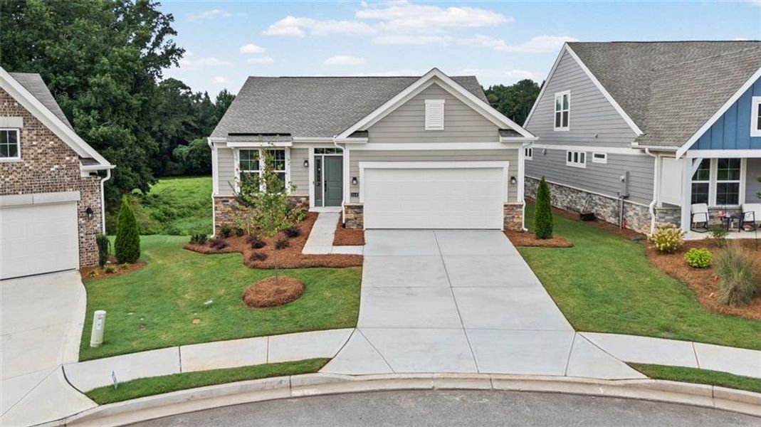 Front exterior of a new home in Laurel Farms, Dallas, GA, highlighting curb appeal (Image 23). Front exterior of a new home in Laurel Farms, Dallas, GA, highlighting curb appeal (Image 23).
