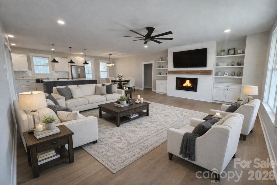 Den has lots of natural light with electric fireplace wall & built ins.