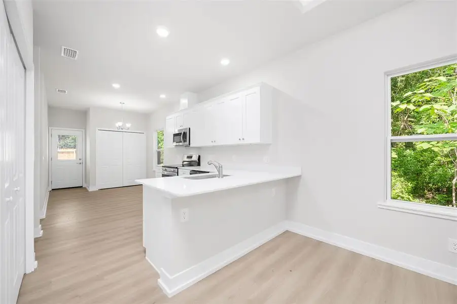 Furnished interior view inside a new home in , High Springs (Image 3).