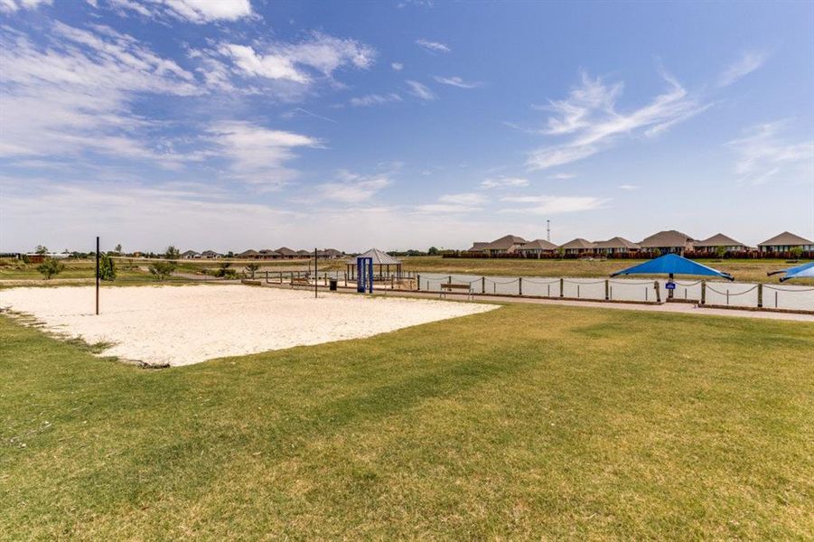 Surrounding community featuring volleyball court and a residential view