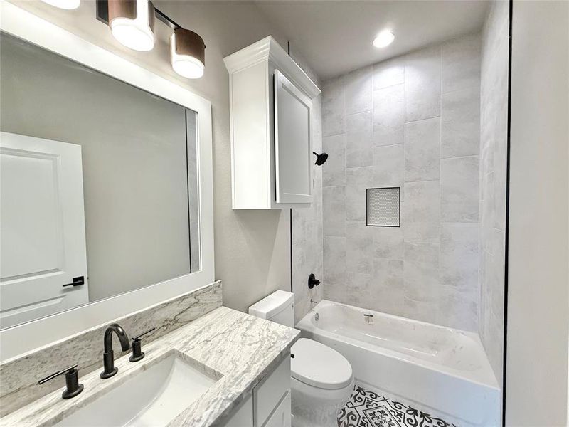 Full bath with bathing tub / shower combination, vanity, and recessed lighting Full bath with bathing tub / shower combination, vanity, and recessed lighting