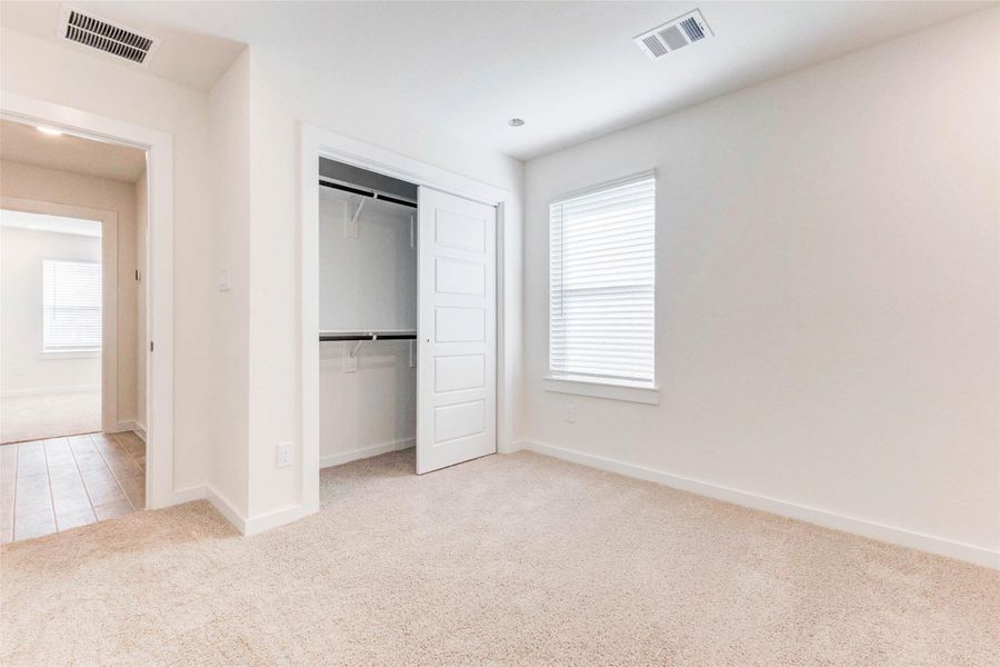 Another versatile bedroom, ideal as a guest room, nursery, or even a home office. The soft carpet flooring, generous closet space, and natural light from the window make this space comfortable and easy to personalize. Another versatile bedroom, ideal as a guest room, nursery, or even a home office. The soft carpet flooring, generous closet space, and natural light from the window make this space comfortable and easy to personalize.