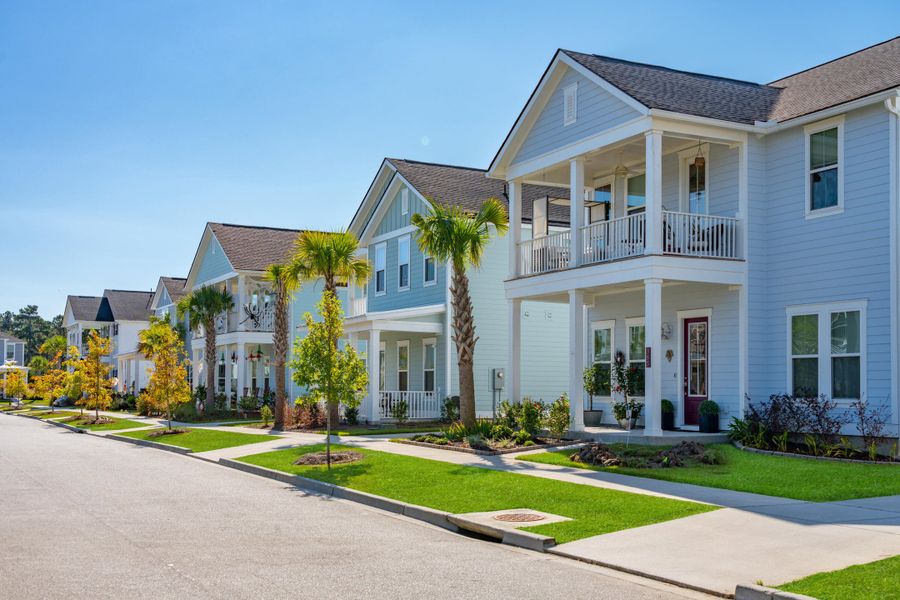 Front exterior of a new home in Sweetgrass at Summers Corner, Summerville, SC, highlighting curb appeal (Image 13). Front exterior of a new home in Sweetgrass at Summers Corner, Summerville, SC, highlighting curb appeal (Image 13).