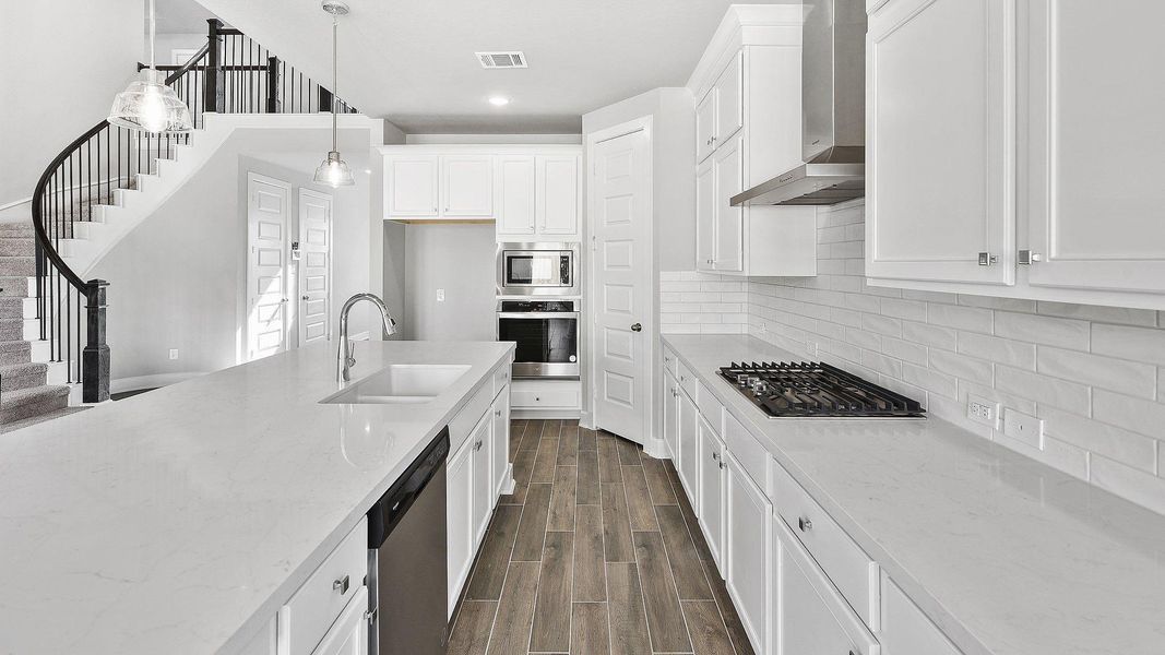 Furnished interior view inside a new home in Sunterra, Katy (Image 13).