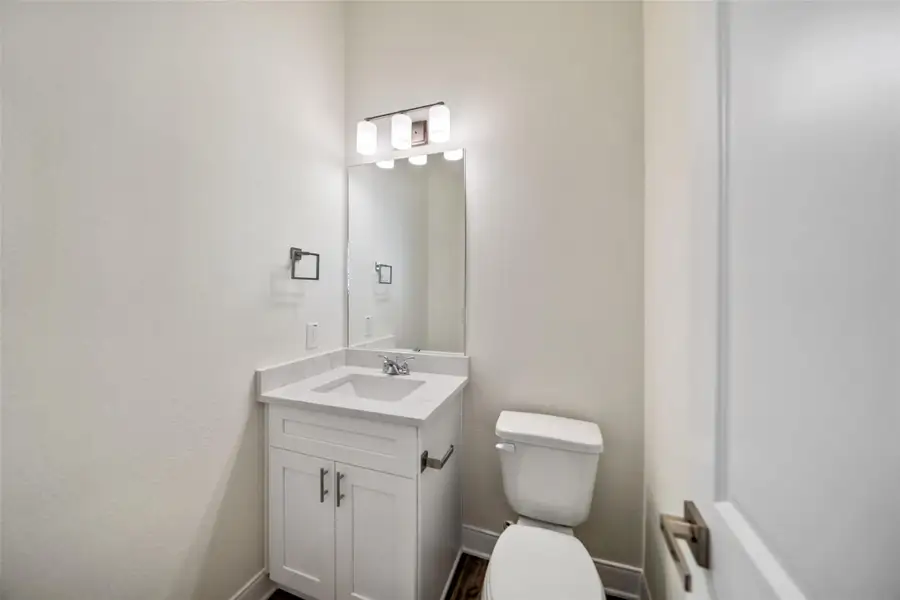 Half bath downstairs off entry.